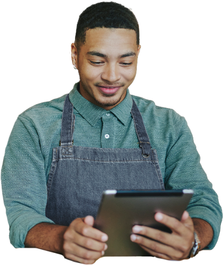 Small café business employee uses Kinetic Business wifi to enter orders for customers on POS tablet